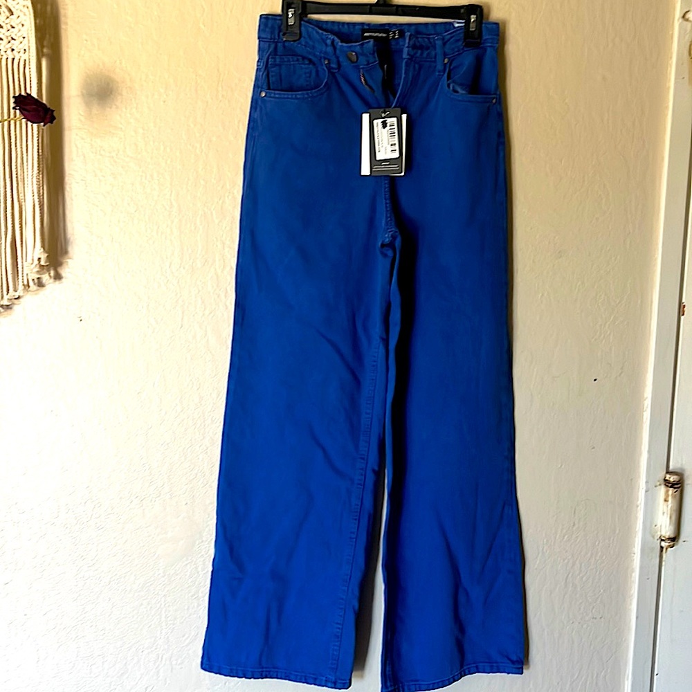 Blue color women’s wide leg jeans.